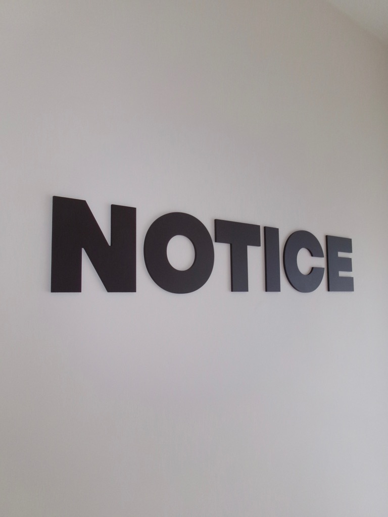 The NOTICE wordmark on our studio wall